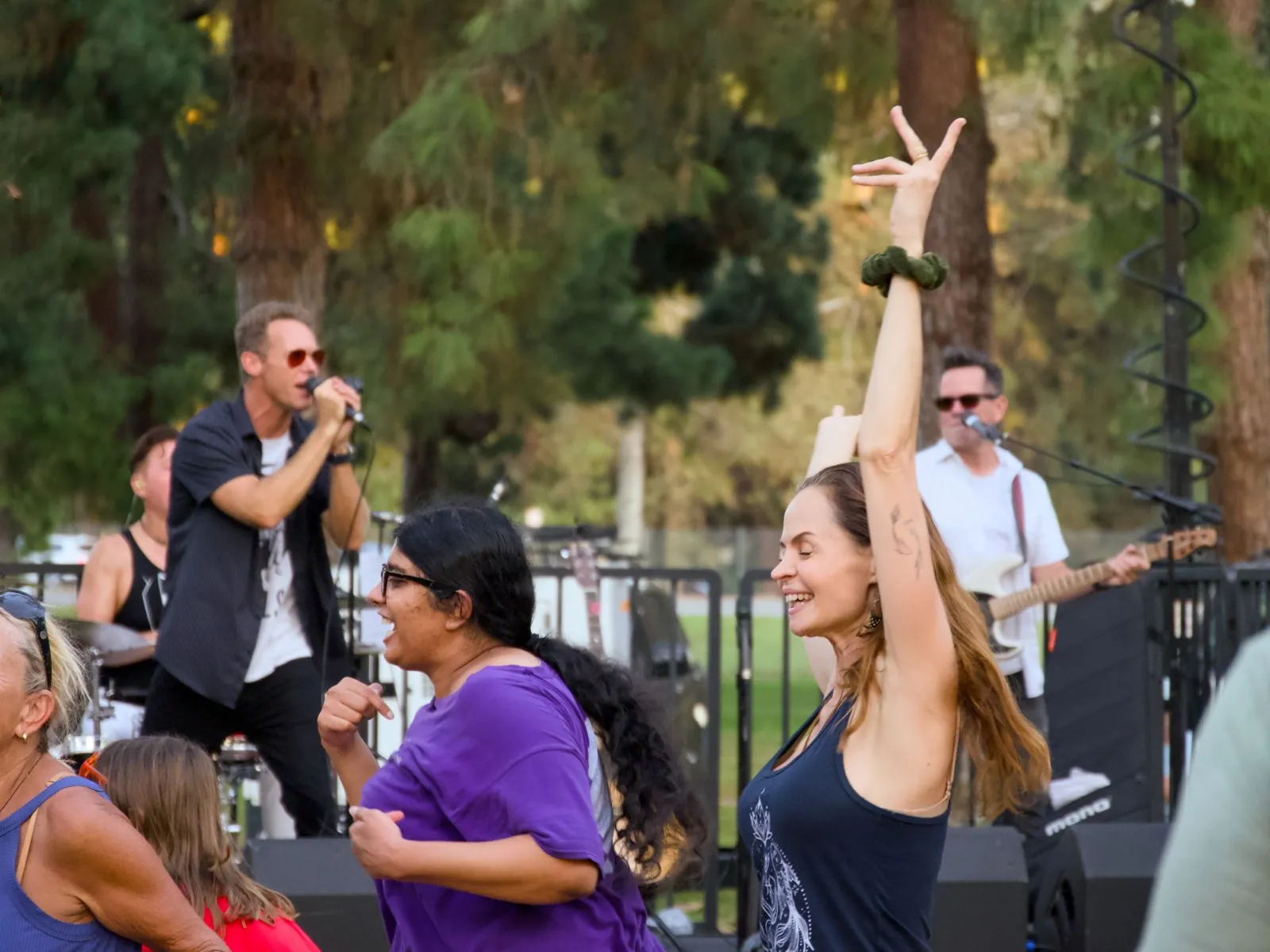 Singer Matt Carmichael down front, singing with dancing guests