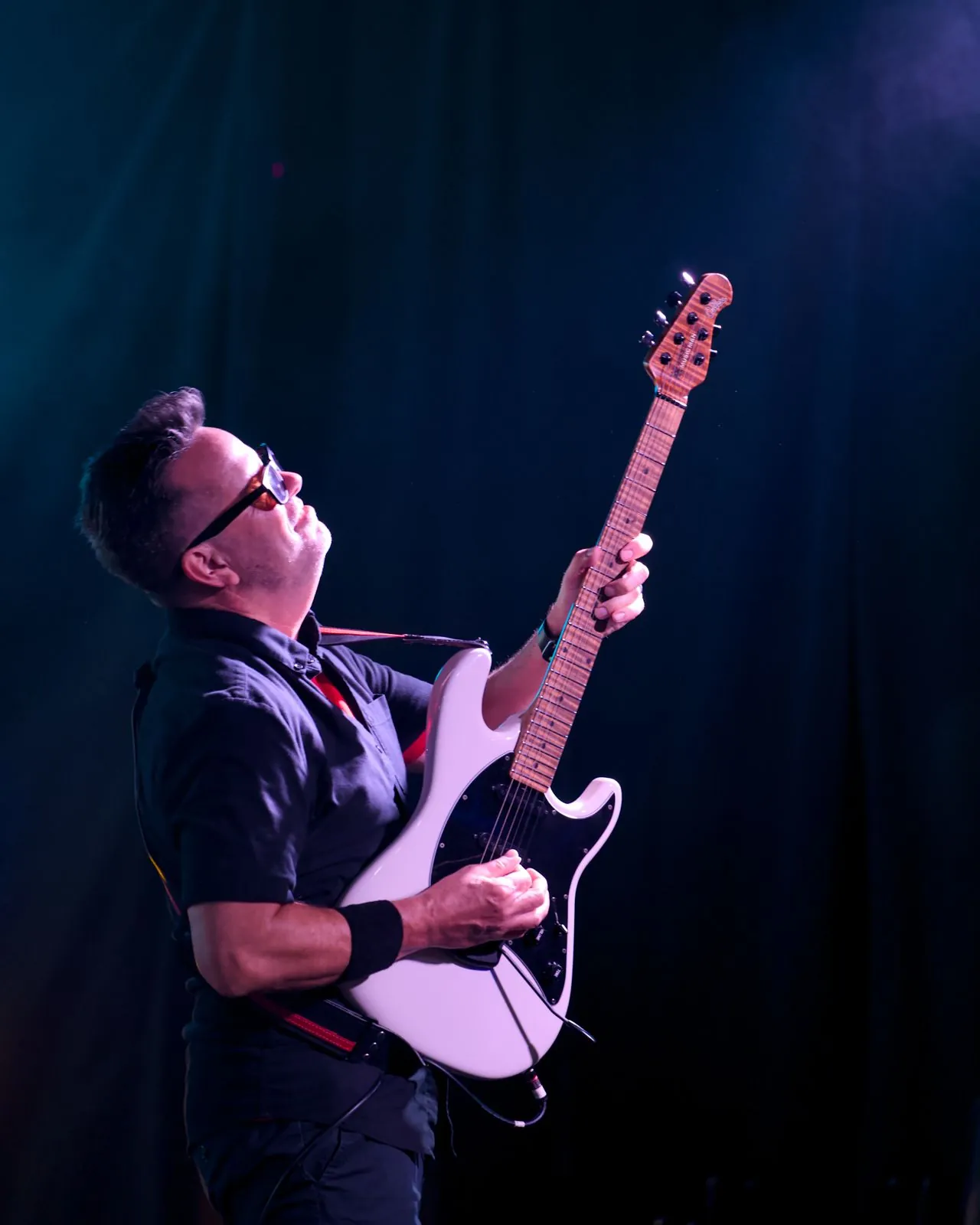 Travis Goertz playing guitar at Gaslamp